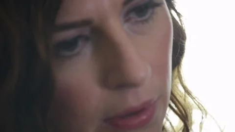 Close up of female singer getting lost the lyrics she's singing Stock Footage 98755989