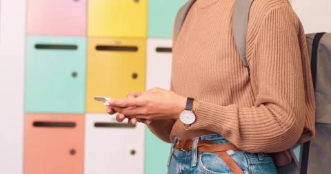 Close up of female student texting on campus Stock Footage 244537012