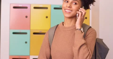 Close up of female student texting on campus, then answering phone call smiling Stock Footage 244538041