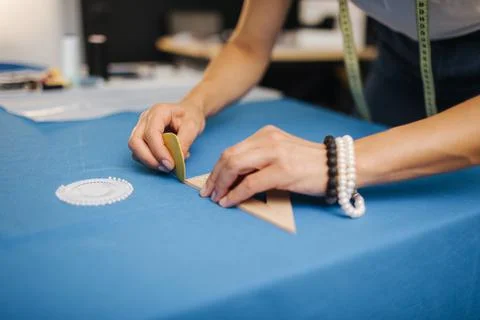 Close up of female tailor using sewing pattern Stock-Fotos