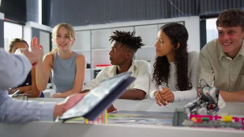 Close Up Of Female Teacher With Digital Tablet Teaching High School Student STEM Stock Footage 240548416