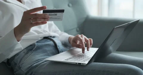 Close up female using banking credit card and laptop for instant and secure Stock Footage 156485916