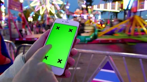 Close up of female using smart phone with a green screen at the West Coast Am Stock Footage 64957289