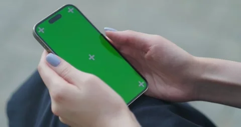 Close Up of a Female Using Smartphone with Green Screen Mock Up Display at Видео 248611641