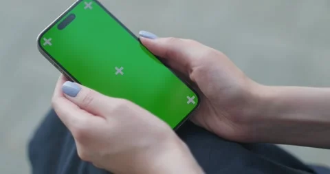 Close Up of a Female Using Smartphone with Green Screen Mock Up Display at 스톡 동영상 249112684