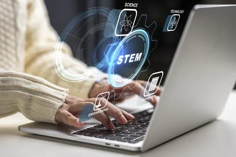 Close-up of a female using a stylus to interact with a digital STEM interfa.. Stock Photos