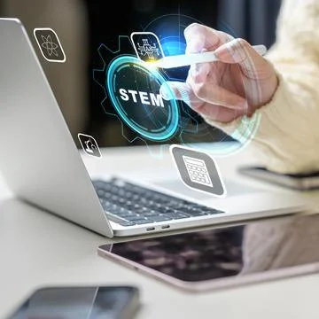 Close-up of a female using a stylus to interact with a digital STEM interfa.. Stock Photos