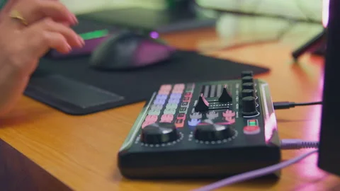 Close Up Of Female Vlogger Using Editing Console For Live Stream Of Channel 動画素材 220593140