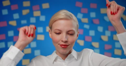 Close-up female in white blouse dancing and fun on background of paper stickers Stock Footage 151655837
