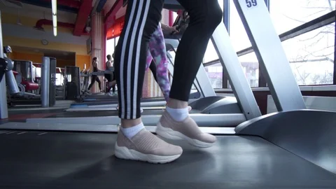 Close up of Female Working out on Treadmill in Gym Stock Footage 122567541