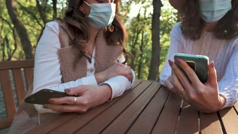 Close up females sitting in table using smartphones. Stock Footage 143991994