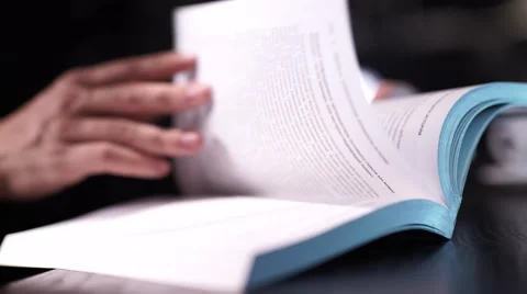 Close up on fenale's finger pointing on text in a book. Stock Footage 56587312