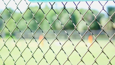Close-up of a fence at a baseball field Stock Footage 93716693