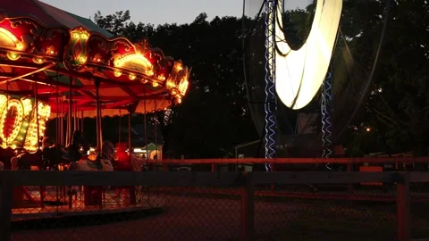 Close Up of a Ferris wheel and carousel Time Lapse. Stock Footage 147977088