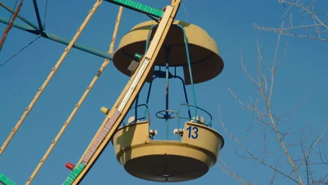 Close-up, Ferris wheel cab in an amusement park with an unlucky number thirteen Stock Footage 202308992