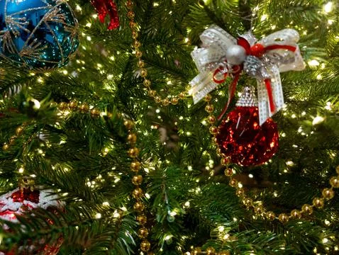 Close-up of festive christmas tree decorations with lights Stock Photos