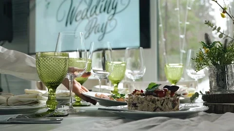 Close-up of a festive wedding table with glasses and plates Stock Footage 156939384