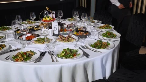 Close-up of festively served plates and glasses on the table. Video stock 248146641