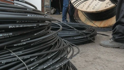 Close-up. fiber optic cable on a large wooden spool. Stock Footage 126940573