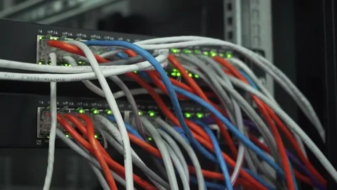 Close up fiber optic in server room. Network cables installed in the rack at Stock Footage 131405060