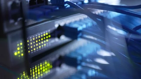 Close up fiber optic in server room. Network cables installed in the rack at Stock Footage 154851453