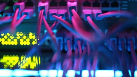 Close up fiber optic in server room. Network cables installed in the rack at Stock Footage 168543588