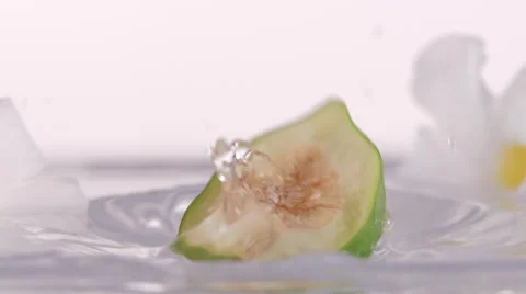 Close Up Of Fig Dropping Slowly Into Water Stock Footage 52960244