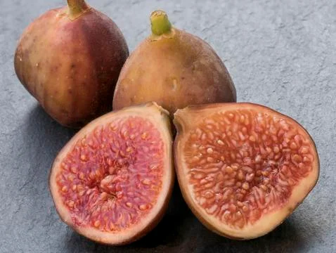 Close-up of figs on dark stone  background Stock Photos
