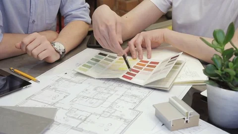 Close up figures of workers discussing business project in office Stock Footage 77550673