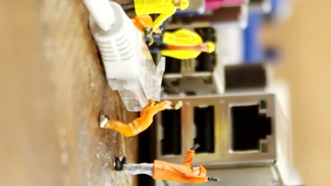 Close-up of figurine with cable and computer socket Stock Footage 301271258