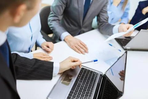 Close up of files and laptop computer in office Stock Photos