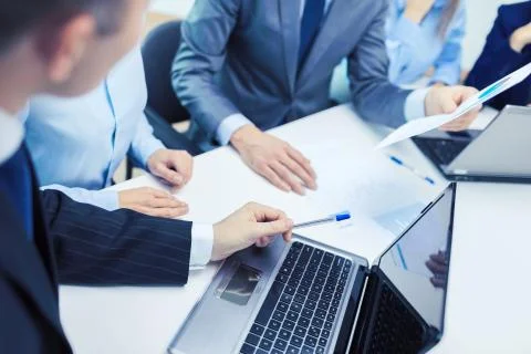 Close up of files and laptop computer in office Stock Photos