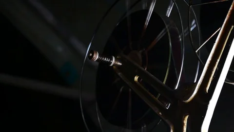 Close up  Film Roll is spinning while projecting In the movie theater in 4k o Stock Footage 86587821