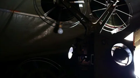 Close up  Film Roll is spinning while projecting In the movie theater in 4k o Stock Footage 86587871