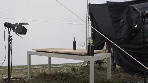 Close up of filming set with softboxes and table with wine bottle, Portugal Stock Footage 129068791