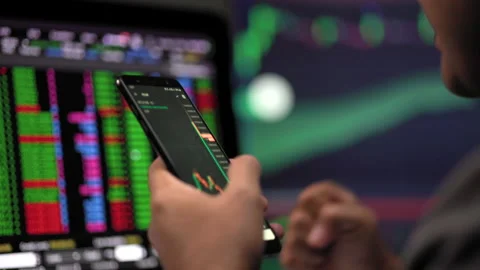 Close-up financial using smartphone analyze exchange rate diagram victory moment Stock Footage 185351359