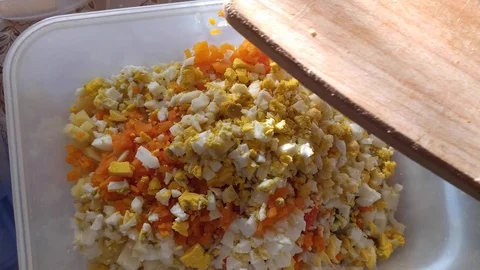 Close-up. finely chopped vegetables and meat in a container. Olivier salad Stock Footage 121003735