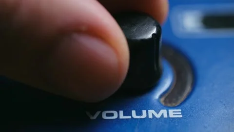 Close up of a finger adjusting the volume knob on a sound mixer Video stock 337830893