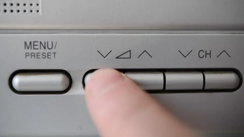 Close-up of finger adjusting volume on old TV. Stock Footage 306397793
