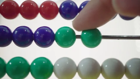 Close-up of finger of beads on abacus shifting Stock Footage 96072932