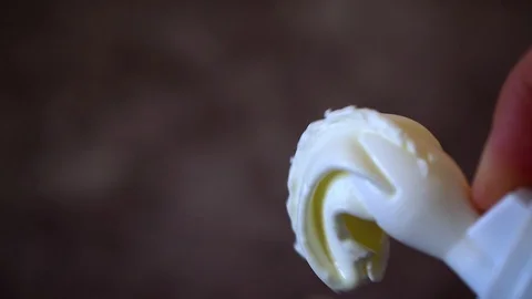 Close-up finger clicks on a can of whipped cream running down Stock Footage 127701742