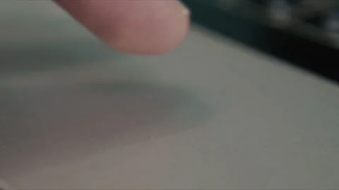 Close up finger interacting with laptop touchpad during digital input operation Stock Footage 340401210
