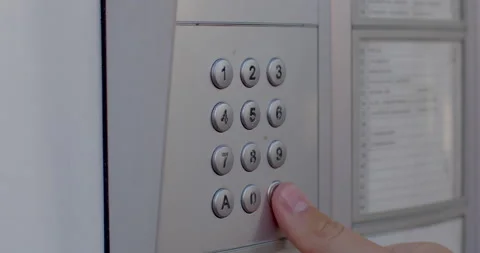 Close-up finger presses intercom buttons. Remote call apartment open door Video stock 201157146