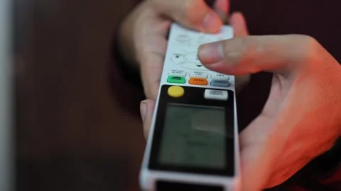 Close Up of Finger Pressing Button on Air Conditioner Remote Control Stock Footage 337847295
