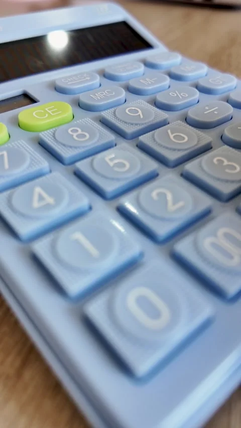 Close Up of Finger Pressing Calculator Buttons Stock Footage 338371875