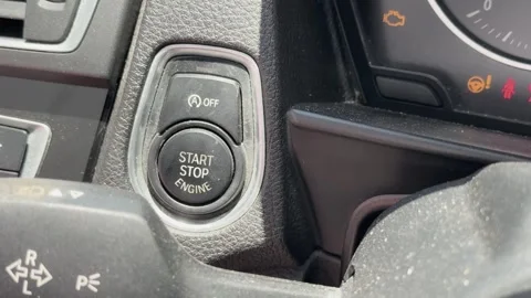 Close Up of Finger Pressing Car Engine Start Stop Button Stock Footage 326272909