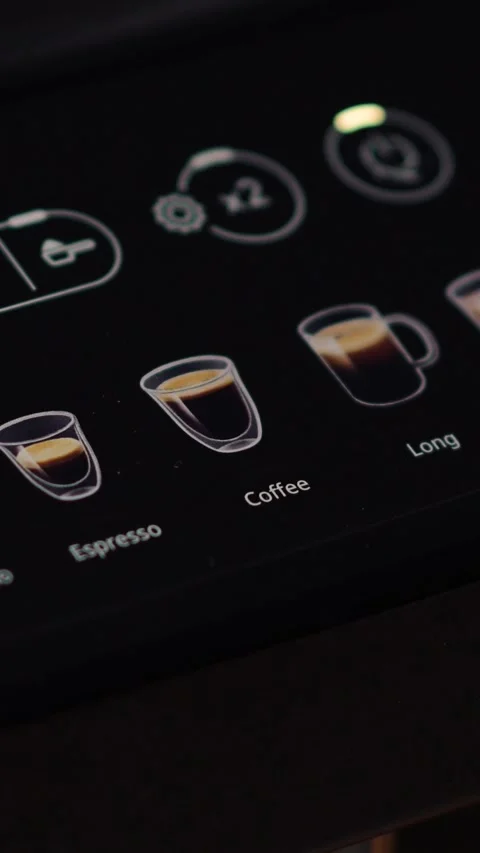 Close-up of a finger pressing the coffee button on a coffee machine Stock Footage 313622991