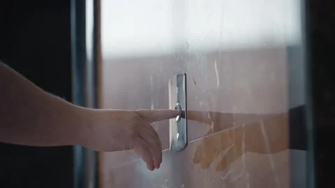 Close-up of a finger pressing an elevator button slowly. A detailed shot of a Video stock 291451332