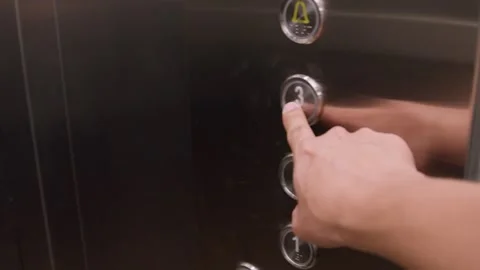 Close up finger pressing elevator button on third floor apartment POV elevator Stock Footage 306005542