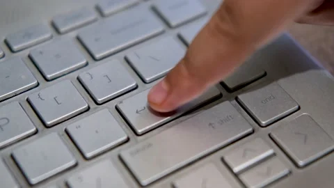 Close Up Finger pressing Enter Button on Keyboard Laptop Stock Footage 202470314